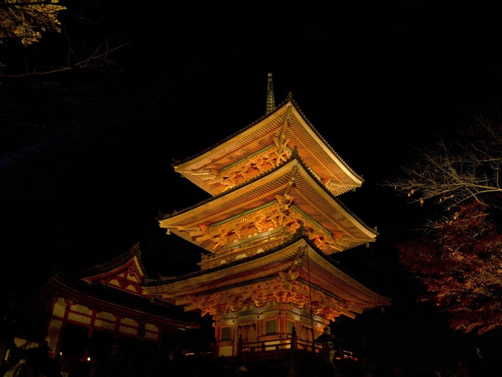 View of Kiyomizu-dera Pagoda and Kyoto cityscape in warm evening light