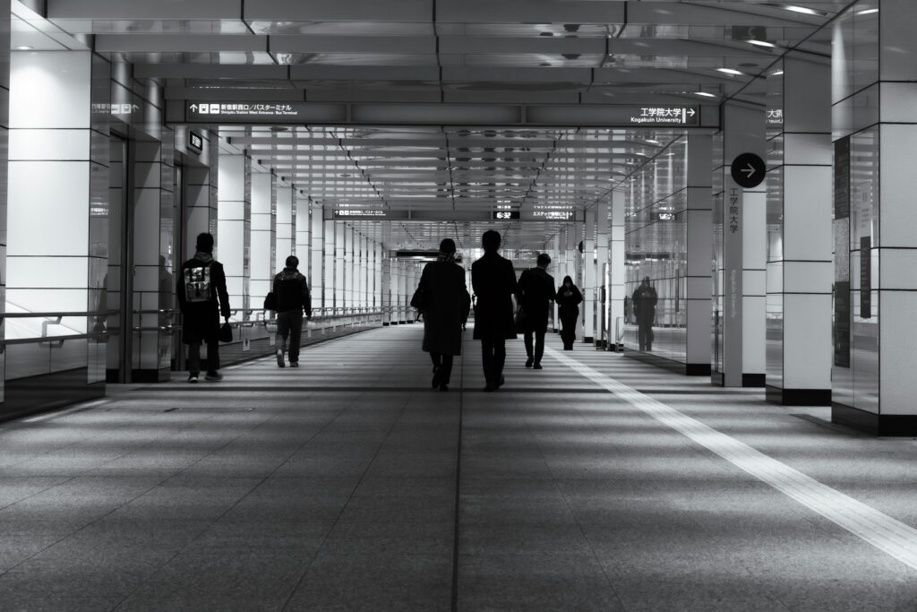 Tokyo train platform with passengers using IC cards for city travel