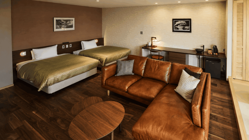 Bedroom and lounge inside an IBUKU Bettei villa