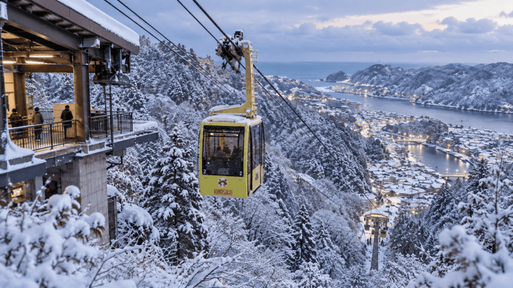 Kinosaki Onsen Ropeway gondola above a snow-covered mountain landscape