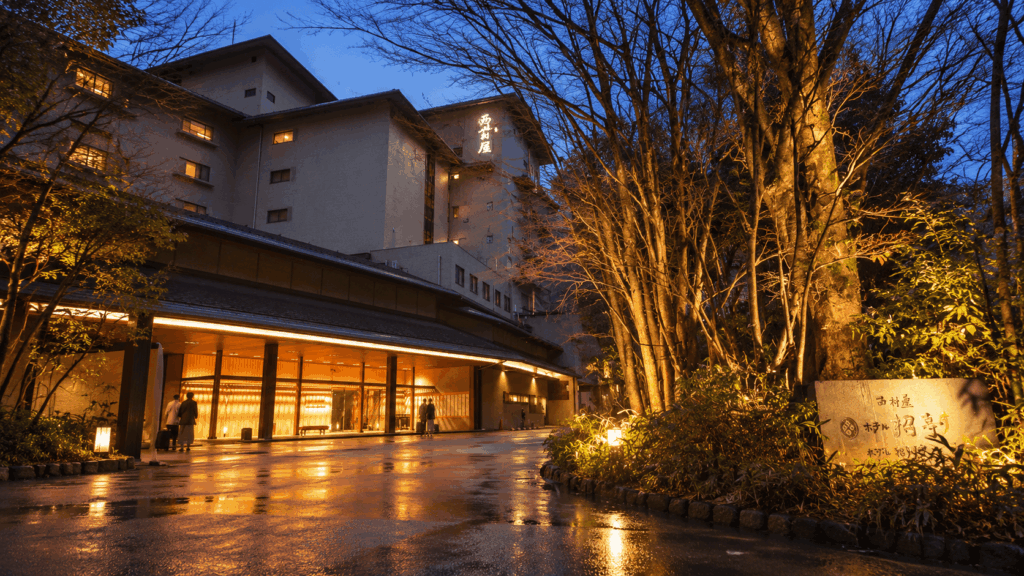 Nishimuraya Hotel Shogetsutei illuminated at dusk in Kinosaki Onsen