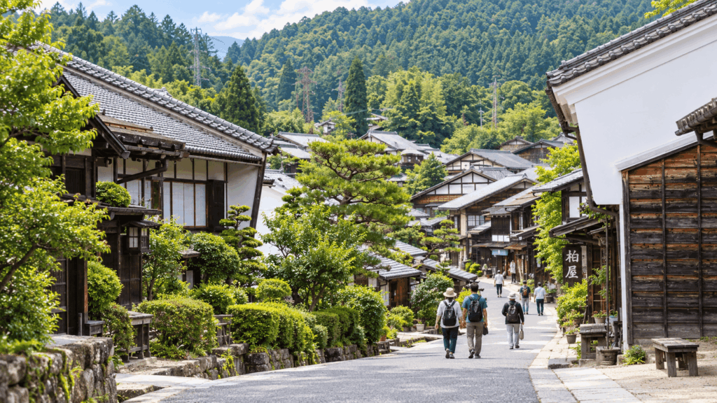 Traditional houses and green mountain scenery in Tsumago-juku on the Nakasendo
