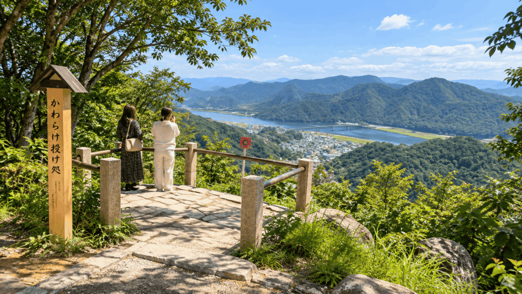 Visitors enjoying the panoramic view from the Mount Daishi Viewpoint above Kinosaki Onsen