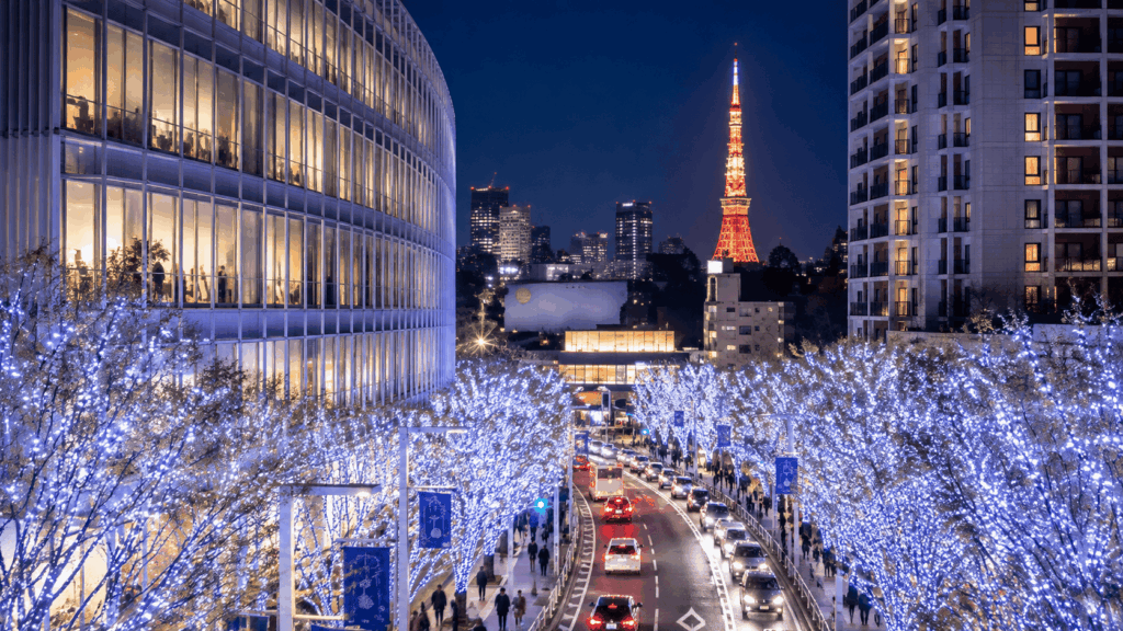 Tokyo Tower glowing above blue winter illuminations in Tokyo at night