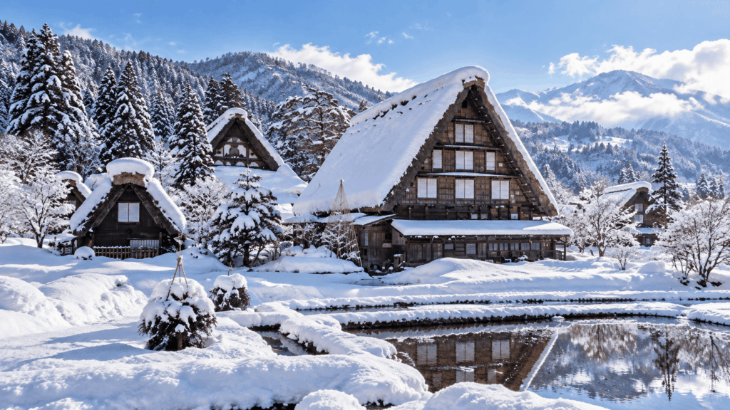 Traditional gassho-zukuri houses with steep thatched roofs covered in thick snow in Shirakawa-go, Japan