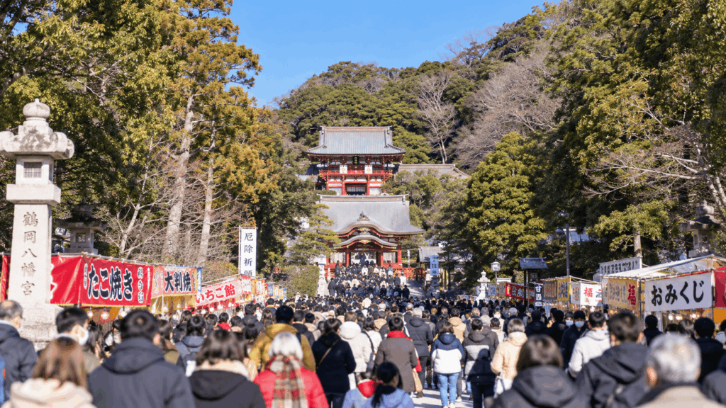 Crowds of New Year visitors walking toward Tsurugaoka Hachimangu Shrine in Kamakura on a sunny January day