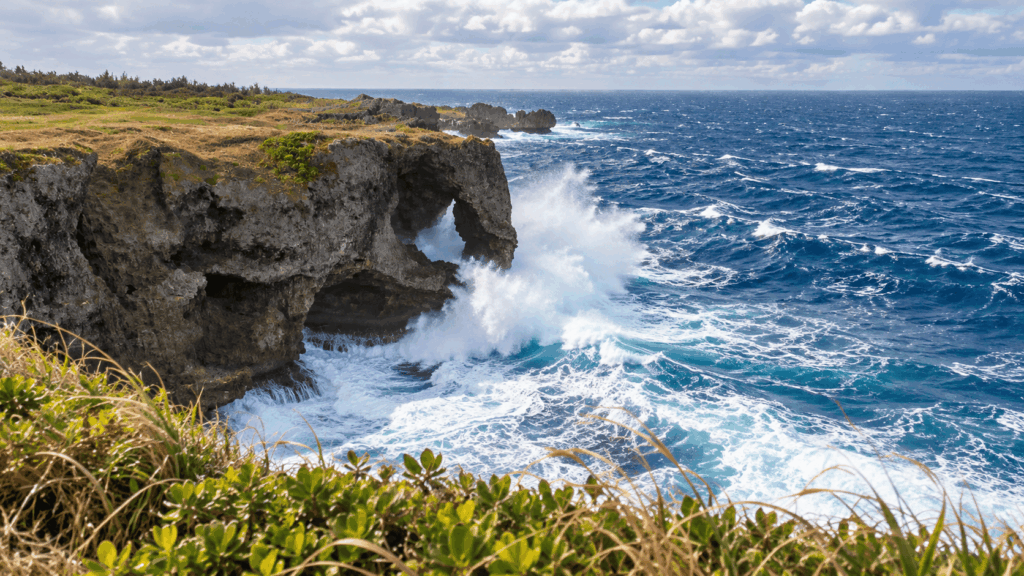 Powerful winter waves crashing against the elephant trunk-shaped rock formation at Cape Manzamo in Onna, Okinawa