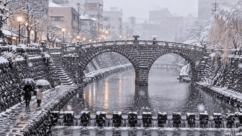 Megane Bridge, also known as Spectacles Bridge, covered in snow during winter along the Nakashima River in Nagasaki